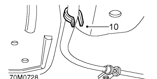 Remove 2 bolts securing handbrake cable clips to body and rear subframe.