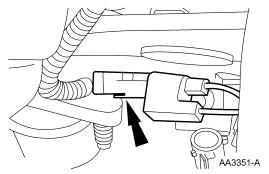 Step 22: Disconnect the radio ignition interference capacitor and remove the engine control sensor wiring.