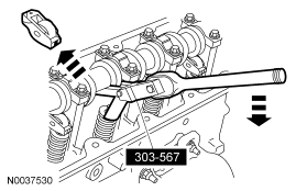 Step 40: Use the special tool to compress the valve springs and remove the camshaft roller followers.