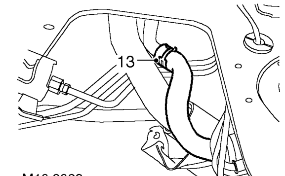 Slide gaiter up filler neck, loosen clip and release hose from filler neck.