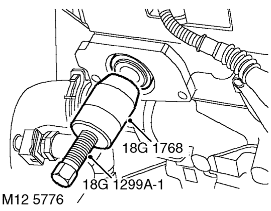 Camshaft rear oil seal - exhaust – Remove 2 bolts securing oil seal cover to cylinder head and remove cover.