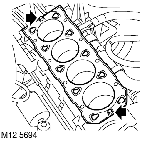 With assistance, remove cylinder head assembly from cylinder block and support on wooden b