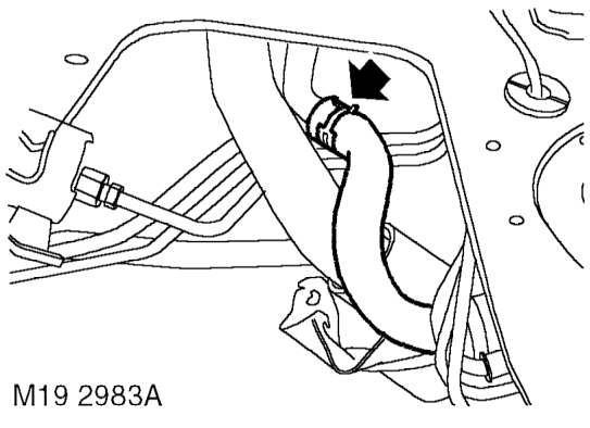 Slide gaiter up filler neck, loosen clip and release hose from filler neck.