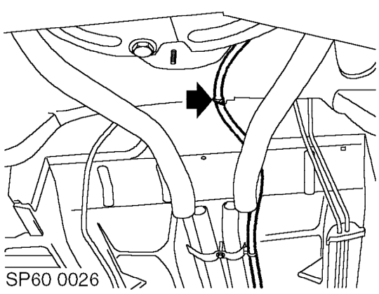 Release clips and disconnect coolant hoses under floor.