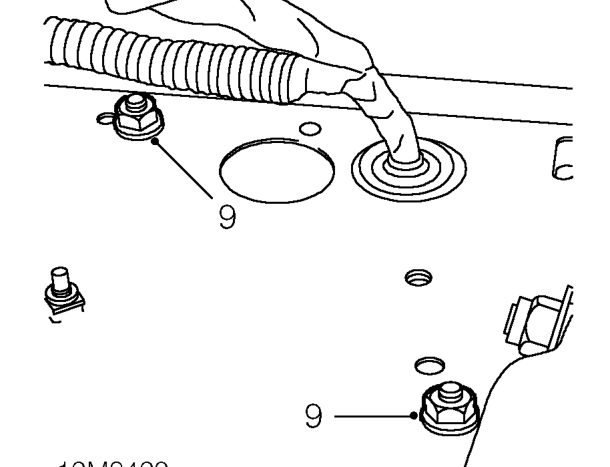 Remove nuts securing expansion tank to mounting bracket and position tank aside.