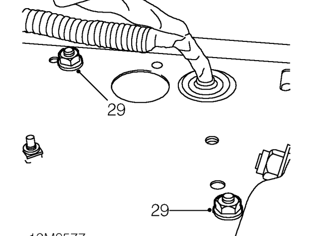 Loosen clip and remove radiator top hose from thermostat housing.