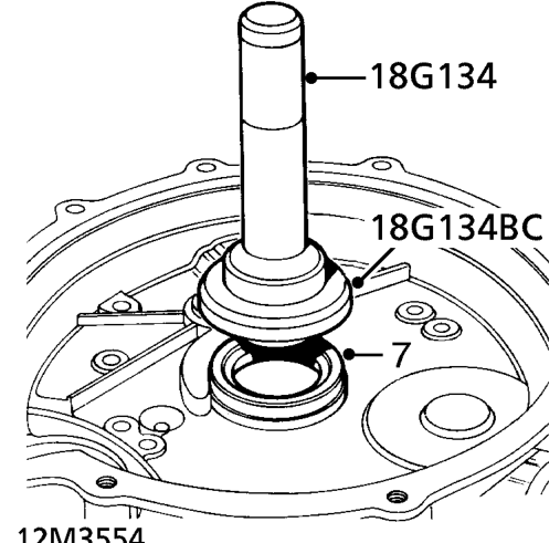 Lubricate NEW flywheel housing oil seal.