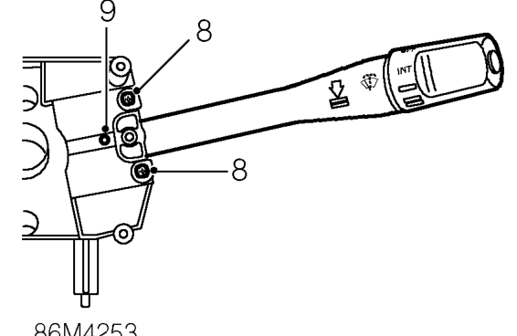 Depress retaining tag and remove indicator/headlamp switch.