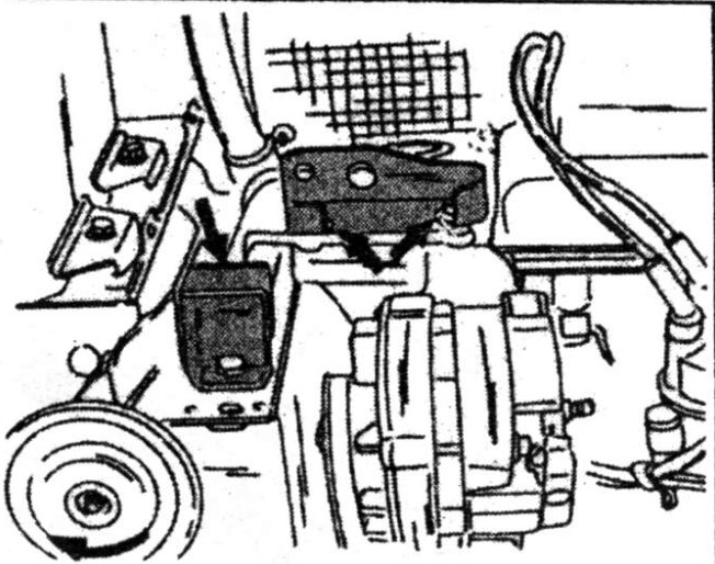Lifting brackets attached to engine with arrows indicating attachment points; horn moved outward to prevent damage