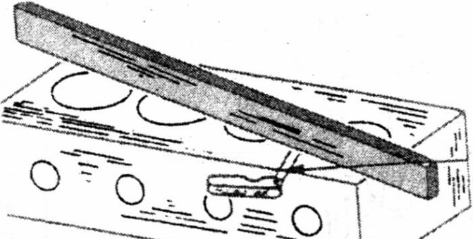 Checking a cylinder head gasket face for distortion using a steel ruler