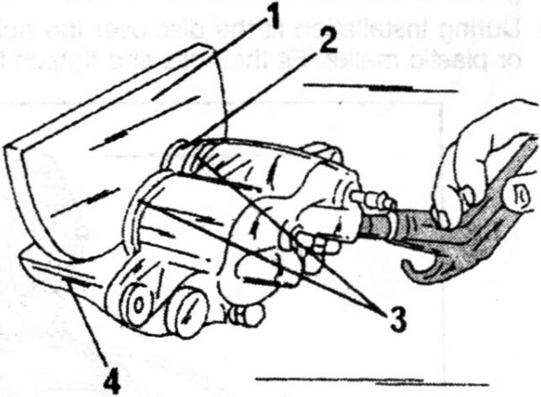Removal of a caliper piston. Insert the piece of hardwood (1) into the caliper opening (4) to protect the piston (2) during removal. Each piston has a dust seal (3).