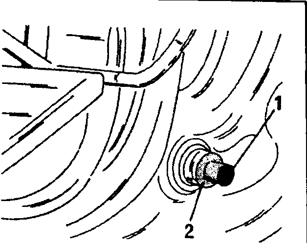 Removal of a sticking brake drum. Push the plunger (1) towards the inside and pull the plastic part (2) towards the outside. The handbrake lever must be pulled before the operation is carried out.