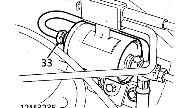 Position absorbent cloth around fuel filter outlet union.