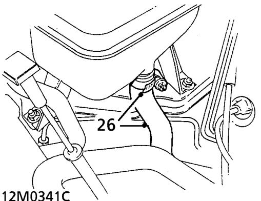 Loosen 2 clips and disconnect 2 hoses from heater.