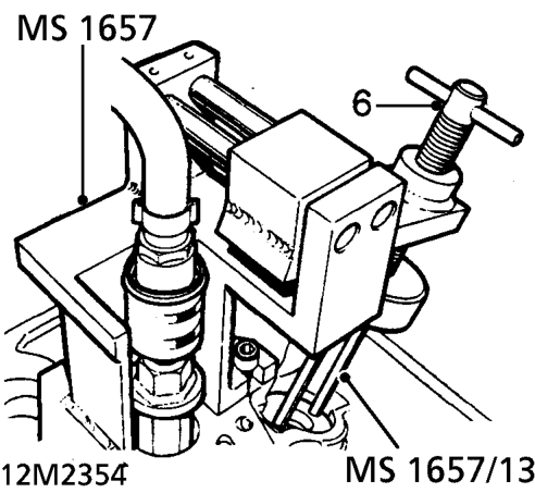 Fit valve spring and spring cap to each valve.