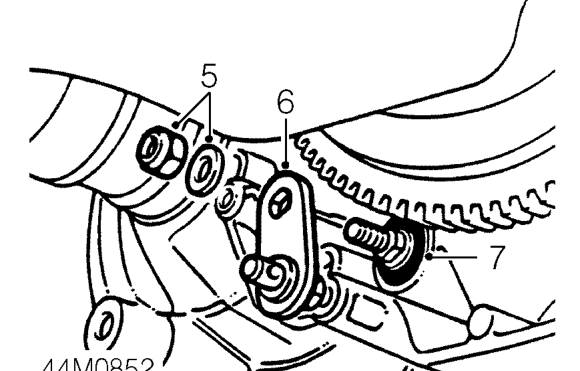 Selector shaft seal – Release selector cable rod from selector lever.