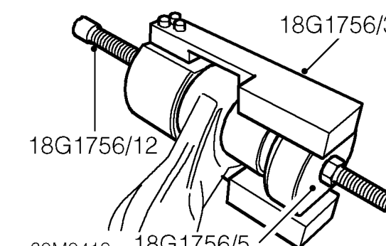 Rotate handle of tool to withdraw bush.