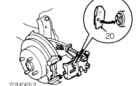 Untie caliper and position to carrier.
