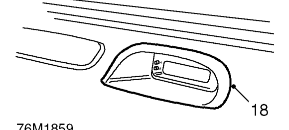 Remove end covers from fascia and remove bolts securing fascia to body.