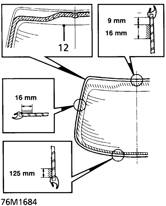 With assistance position rear glass to tailgate, centralise it and fit strips of tape acro
