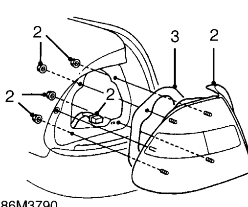 Tail lamp - 5 door – Depress plunger and remove stud from boot side carpet. Release carpet.