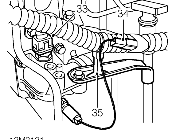 Remove nut securing alternator lead.