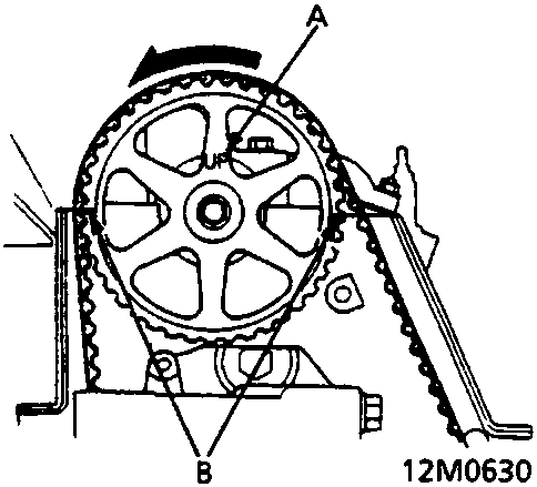 Diagram of camshaft pulley showing timing belt alignment with 'UP' mark and TDC grooves