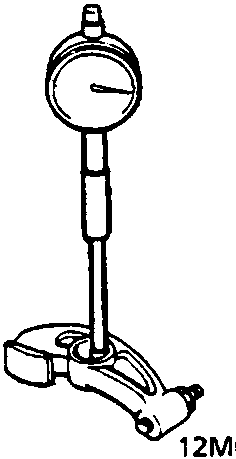 Diagram showing a cylinder bore gauge inserted into a rocker arm to measure inside diameter
