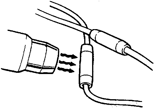 Diagram showing a hot air blower being used to shrink a connector onto a wiring harness joint