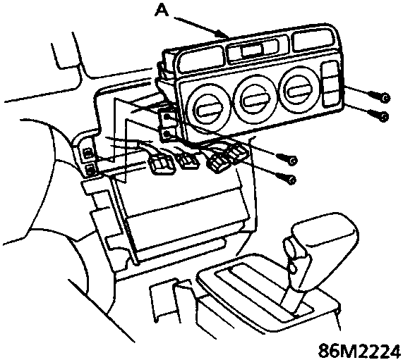 Heater control panel assembly being removed from dashboard