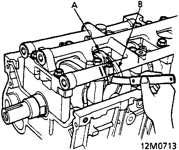 Diagram showing connecting rod and crankshaft being checked with a feeler gauge