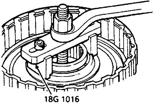 Diagram showing a tool compressing a return spring within a clutch assembly
