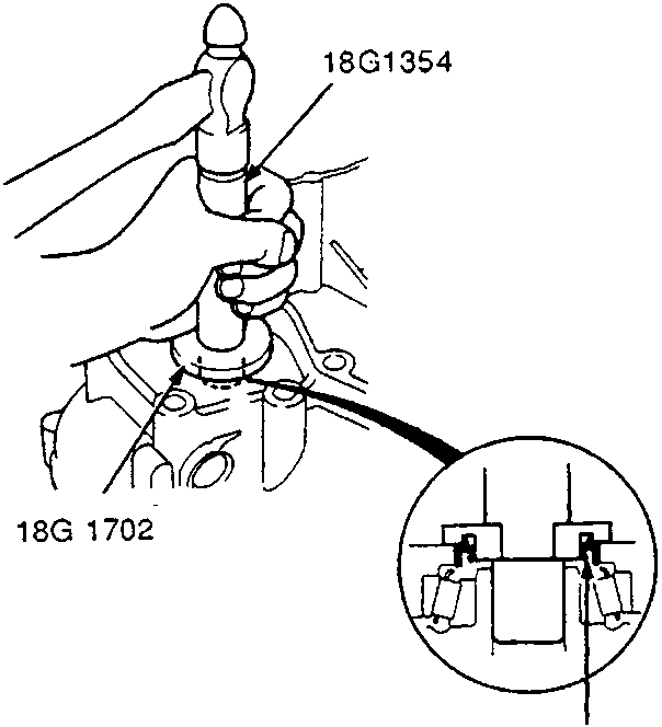 Diagram showing driving oil seal into torque converter housing using special tools 18G1354 and 18G 1702