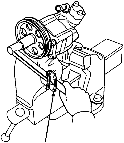 Diagram showing a torque wrench (A) being used to check the preload on a power steering pump held in a vice.