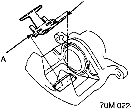 Diagram showing removal of pad spring from caliper body