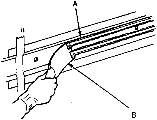Diagram showing scraping adhesive tape with putty knife, callouts A (Adhesive tape) and B (Putty knife), figure number 76M 0975