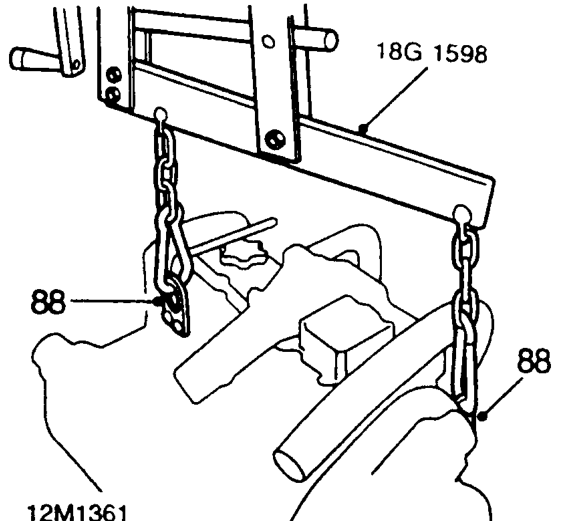Remove 4 bolts securing front beam and remove using assistance.