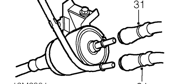 Position cloth to absorb fuel spillage.