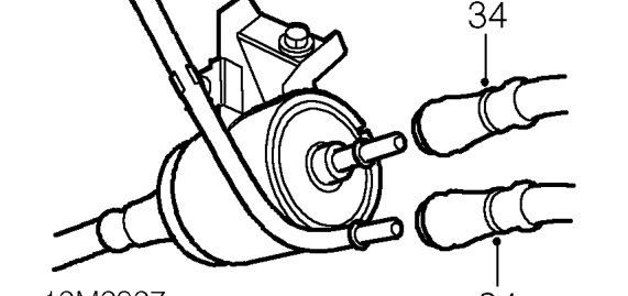 Position cloth under fuel filter to absorb fuel spillage.
