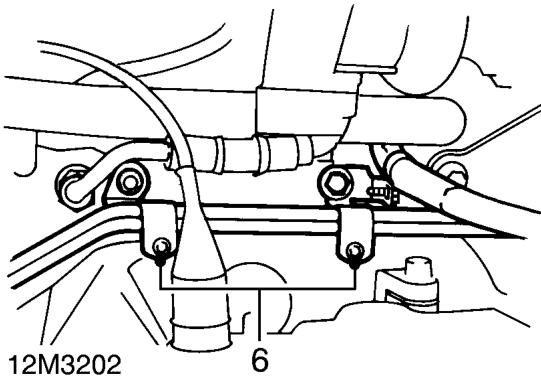 Release cover from reverse light switch and disconnect multiplug.