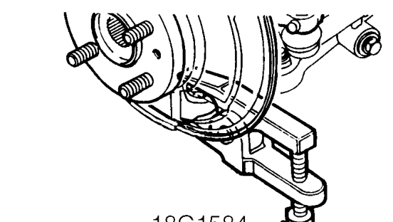 Loosen castellated nut securing front hub to lower arm, until flush with the end of the jo