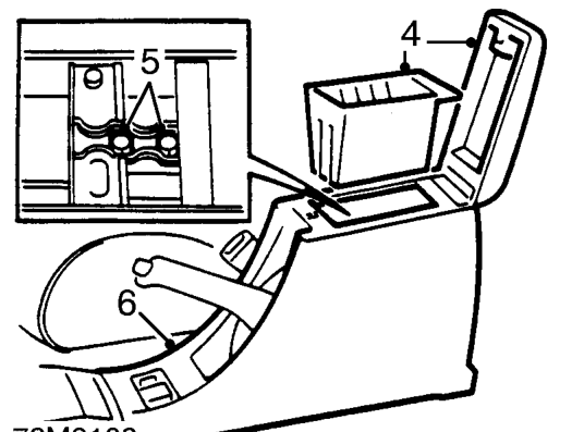 Rear console – Remove 2 bolts securing front of rear console to body.