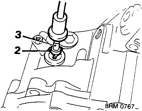 Diagram showing the gearbox end of the speedometer cable with callout numbers 2 and 3 pointing to the securing clip and cable connection.