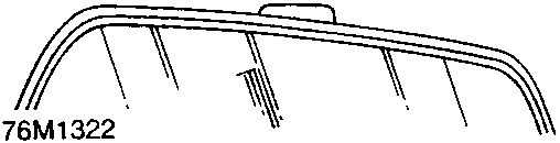 Warning label affixed to the upper section of the windscreen, displaying SRS text and safety pictograms.