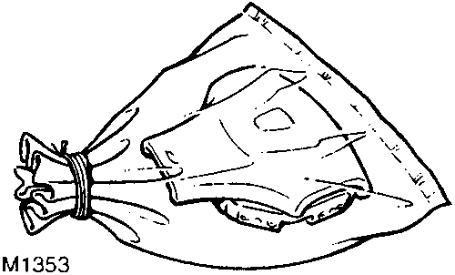 Deployed airbag module placed inside a sealed plastic bag ready for disposal
