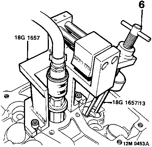 Diagram showing tool 18G 1657 assembled in exhaust valve position with compressor tool 18G 1657/13 locating the spring cap