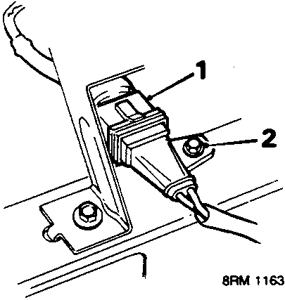Diagram showing the crankshaft sensor multiplug (1) and its securing screw (2) on a bracket.