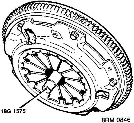 Clutch assembly fitted to a flywheel with an alignment tool inserted through the center