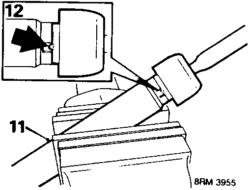 Diagram showing a steering rack held in a soft jawed vice, with callout numbers 11 and 12 indicating the rack teeth and a tool.