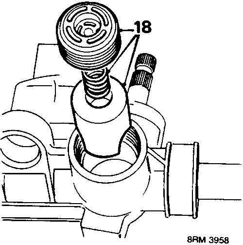 Diagram showing the yoke cover, spring and yoke being removed from the steering rack housing, with callout number 18.